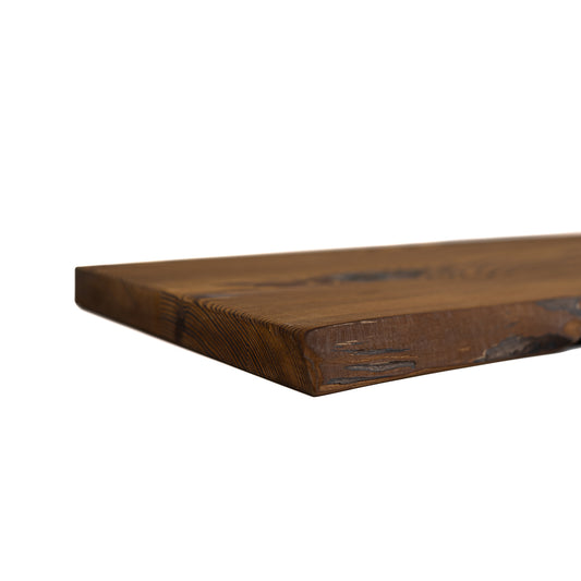 Amber pine live edge floating shelf mounted on wall