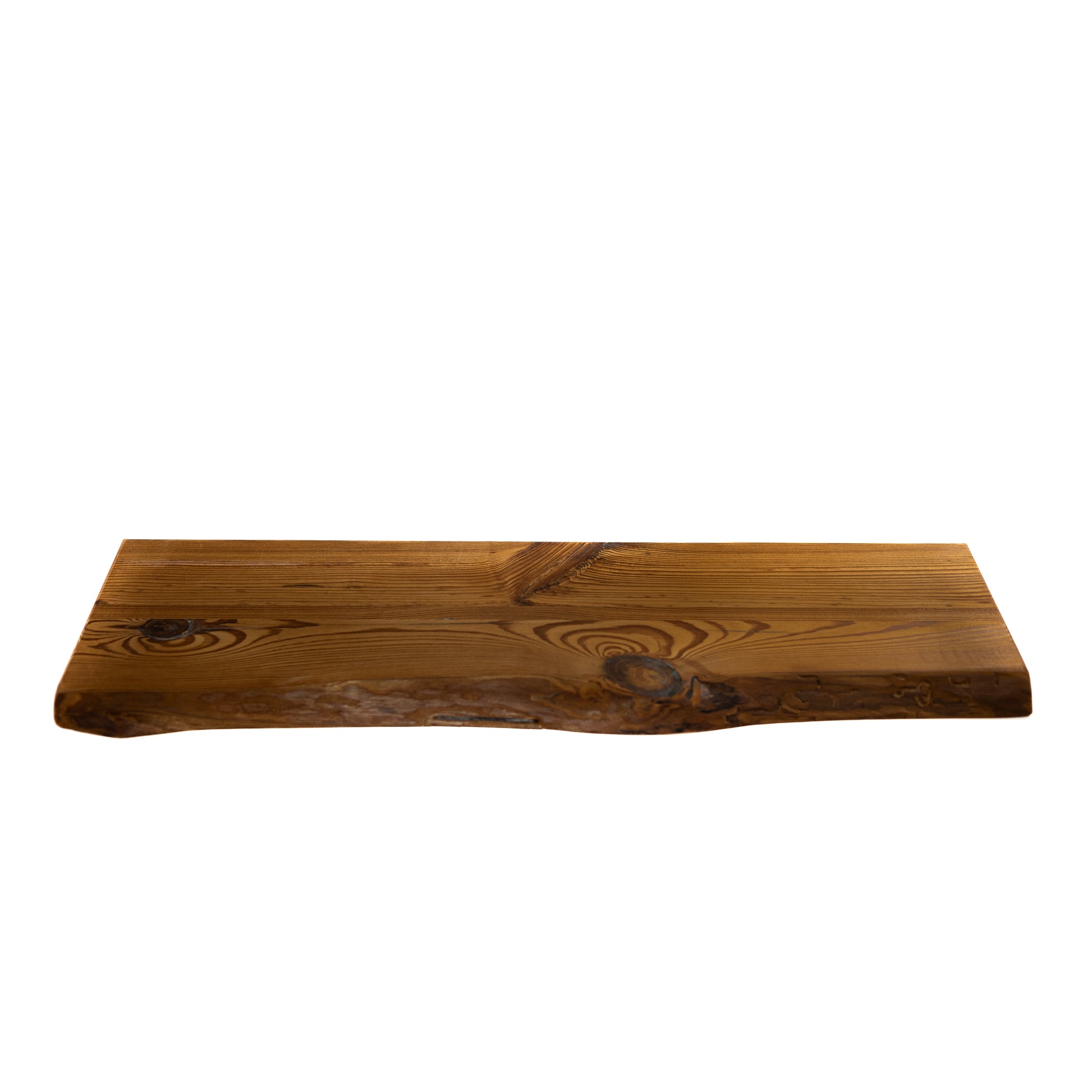 Wooden floating shelf with a natural finish on a white background